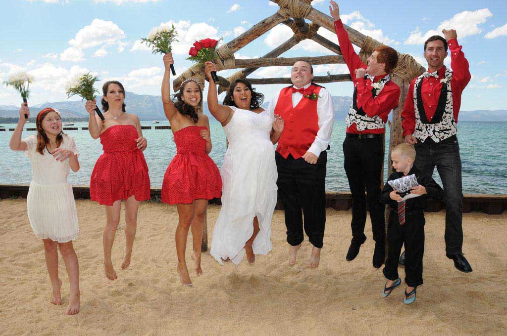The wedding party jumping in the air