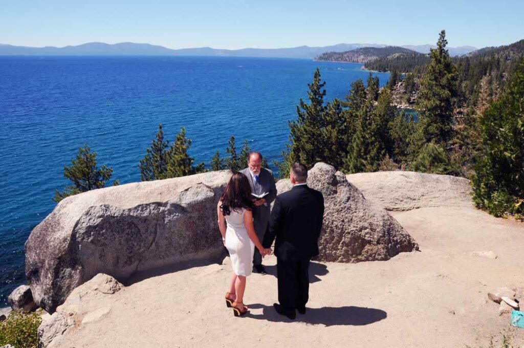 Bride and groom on the bluff at Logan Shoals