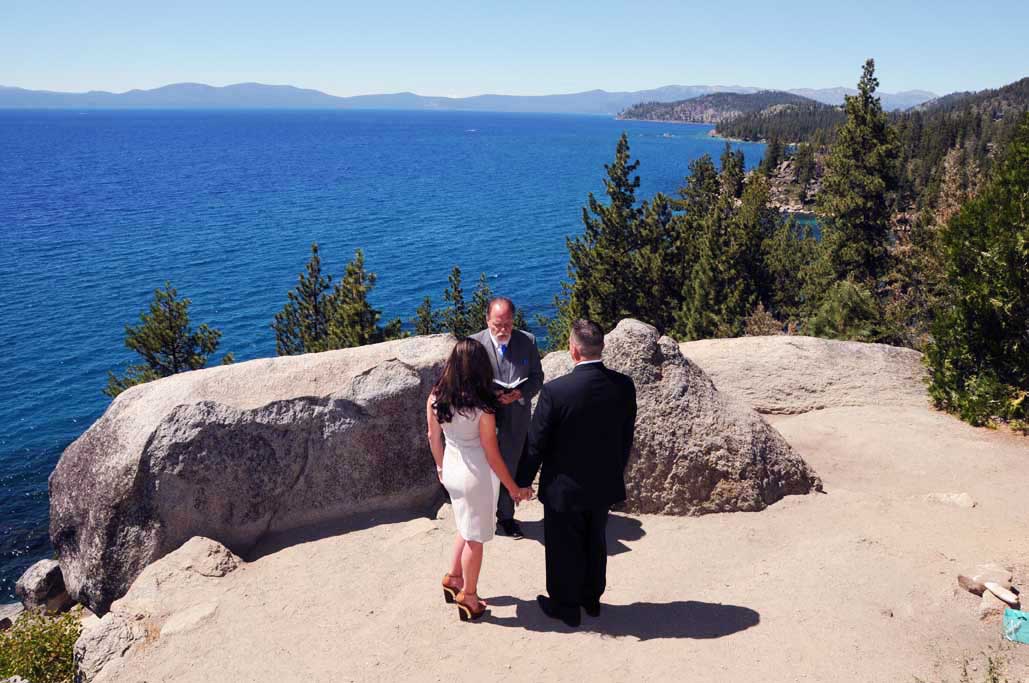 Bride and groom on the bluff at Logan Shoals