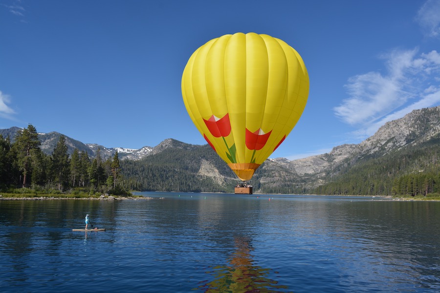 Hot air balloon hovers over Lake Tahoe