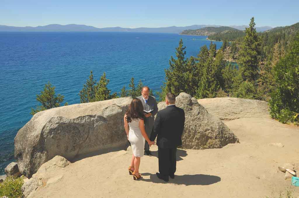 Pastor and couple on the overlook of Logan Shoals