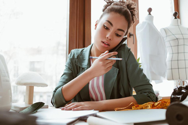 A woman is on the phone in a business environment