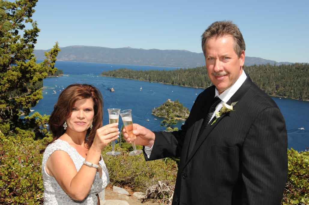 Husband and wife hold toasting glasses in celebration