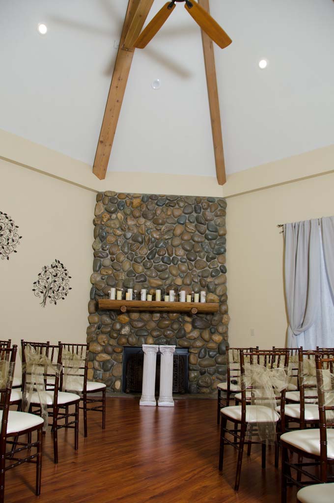 The aisle leading up to the stone mantel at the front of the chapel