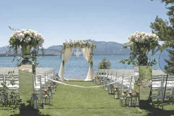 The outdoor wedding chairs and arbor setting