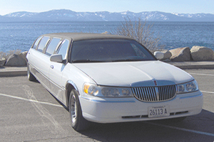 Limousine with lake and mountain background
