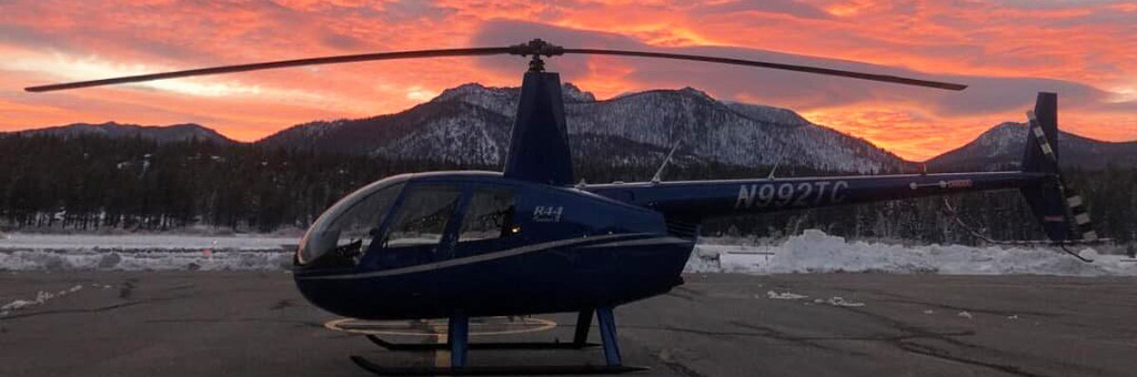 Evening photo of helicopter parked on landing area
