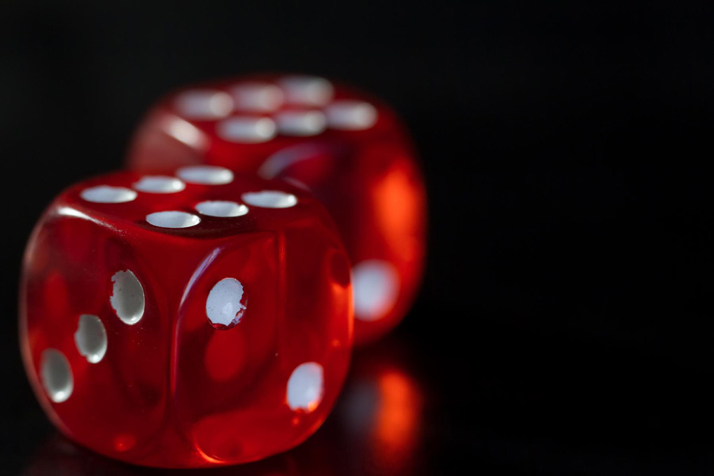 Two red dice showing sixes