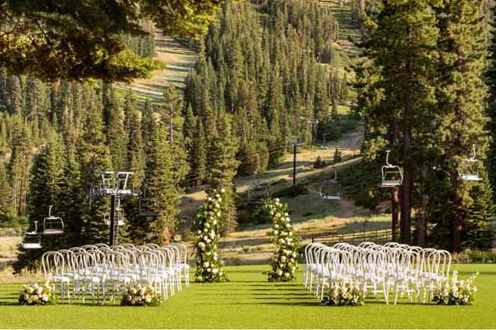 The outdoor wedding area with chairs and decor