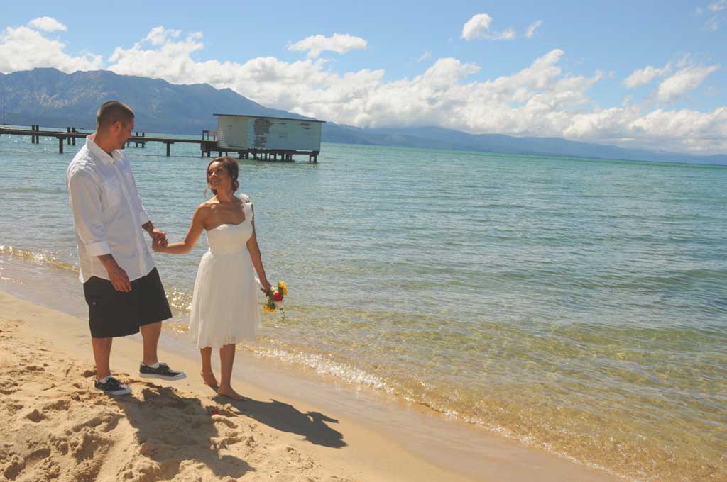 Bride with groom walking while holding hands