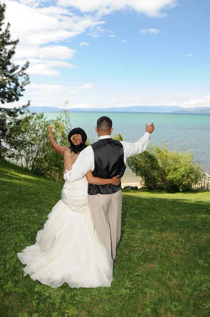Newlyweds raise champagne glasses to toast new marriage