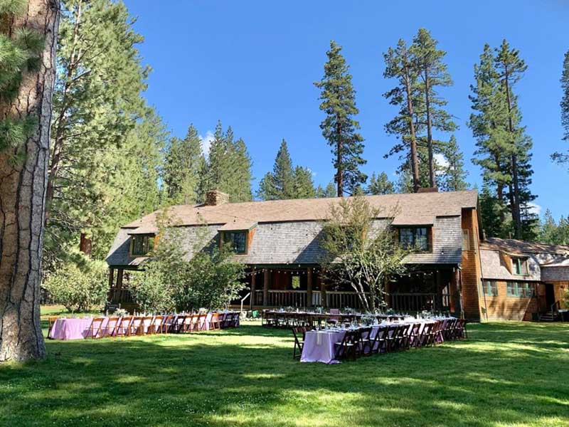 Tables and chairs are setup on the lawn in preparation of an event