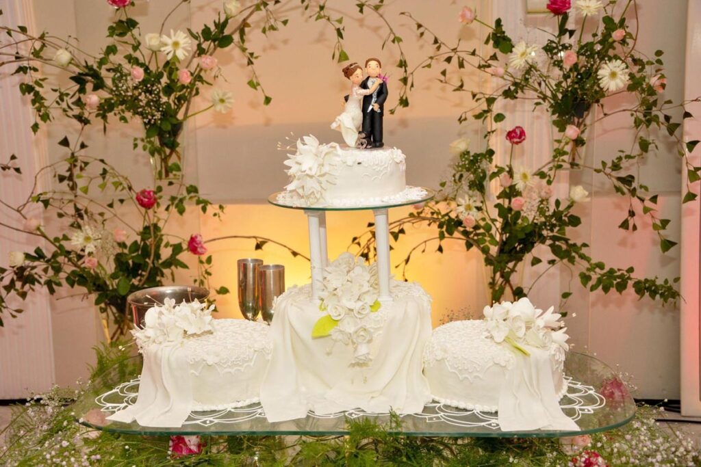 Beautiful wedding cake with bride and groom cake toppers
