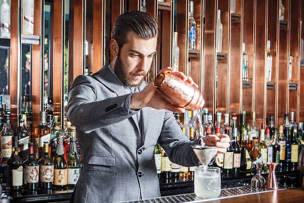 Bartender is preparing a drink