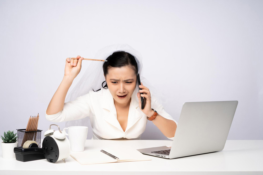 A woman is conducting business on the telephone