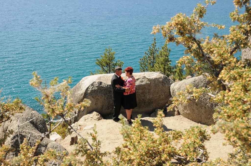 A pair of marriage participants embraced together on the overlook