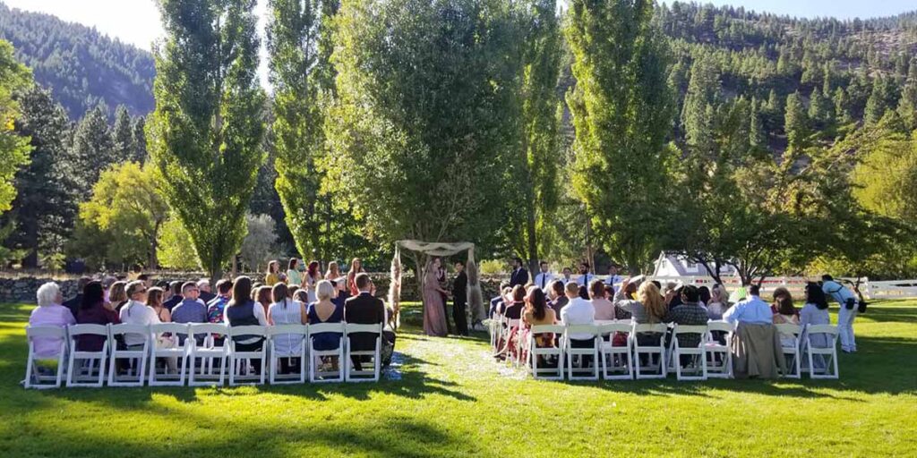 Outdoor wedding in progress at the Orchard House