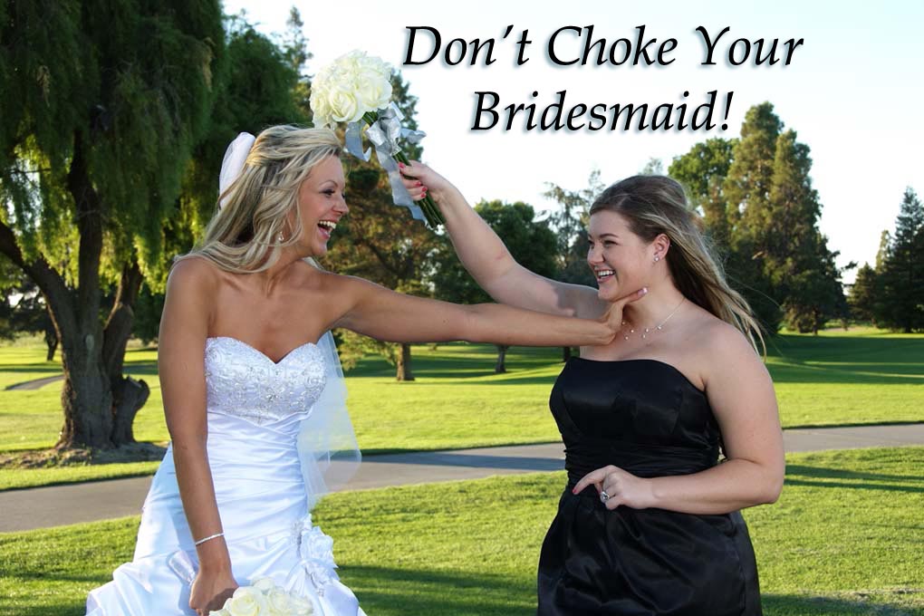 Bride playfully chokes her bridesmaid