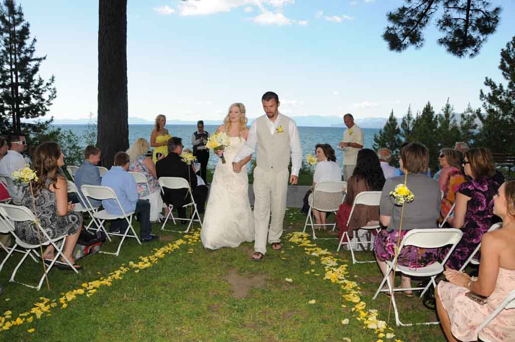The married couple walks down the aisle as the recession commences at the end of the service.