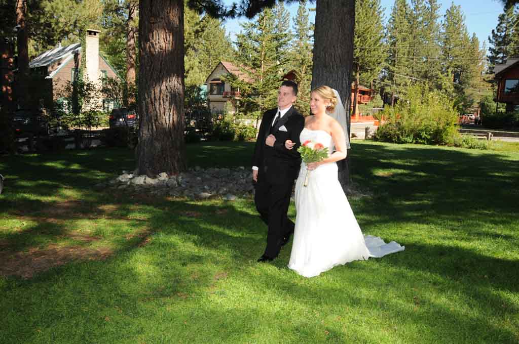 The service begins with the bride and groom walking together on the grass