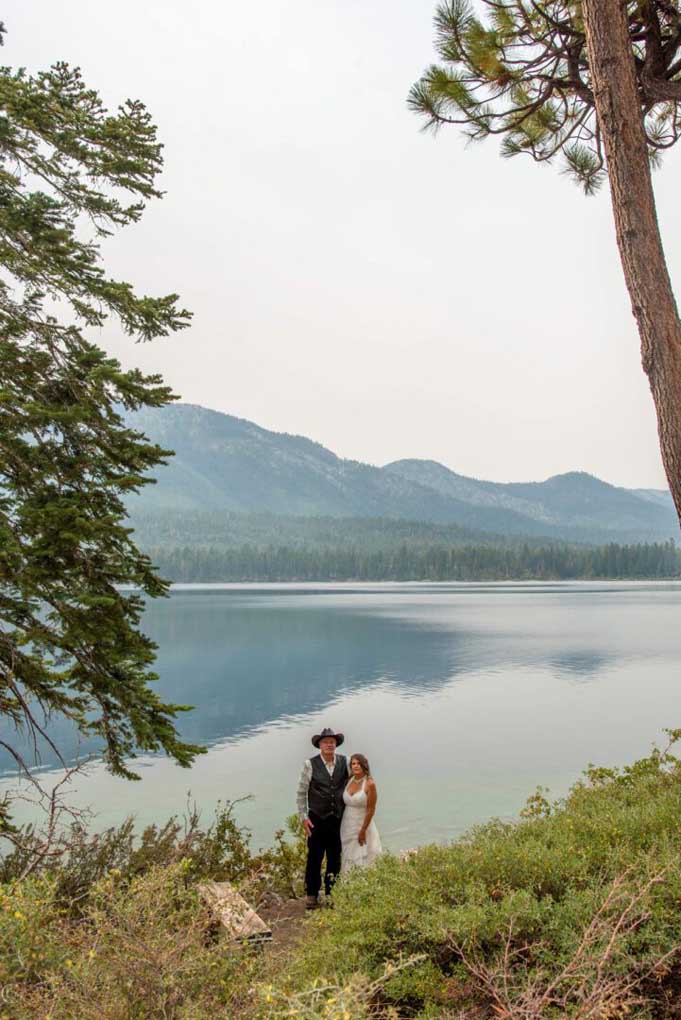 Standing at the edge of the lake after just being pronounced husband and wife
