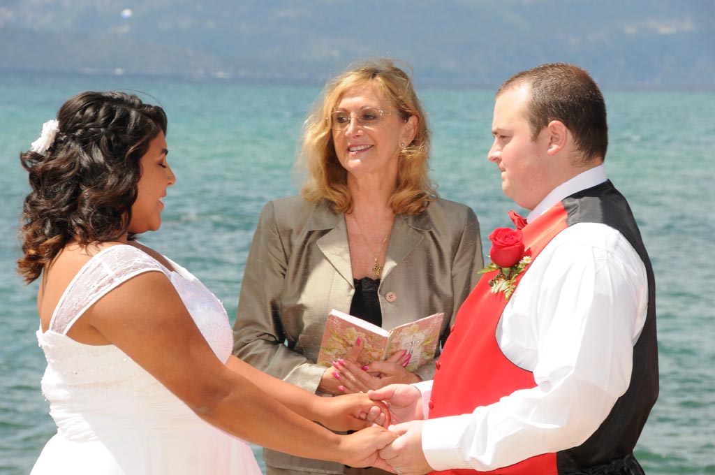 Vows are being exchanged before the minister