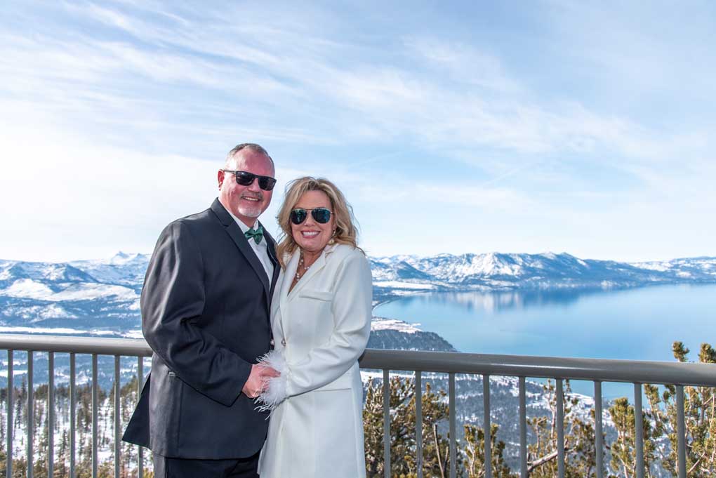The recently wedded pair pose on the observation deck on Heavenly Mountain