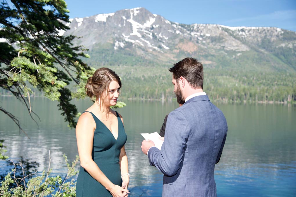 The groom is reciting his vows to his soon to be wife