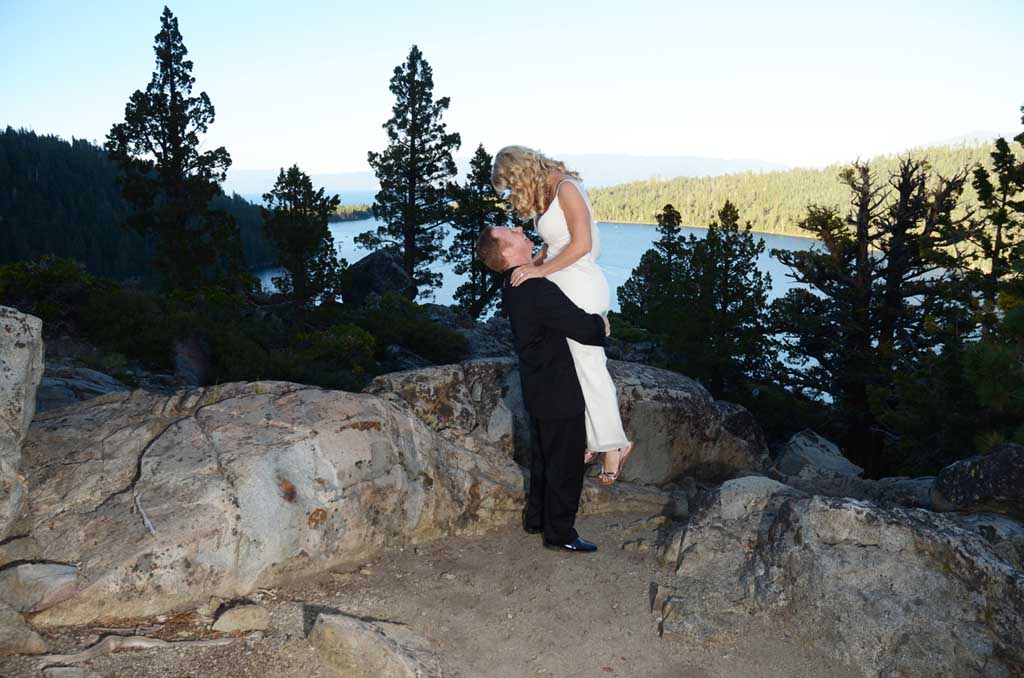 The bride is lifted upward by her new husband