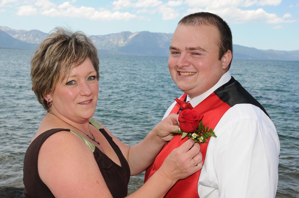 Mom pins the boutonniere on her son prior to his matrimonial walk down the aisle