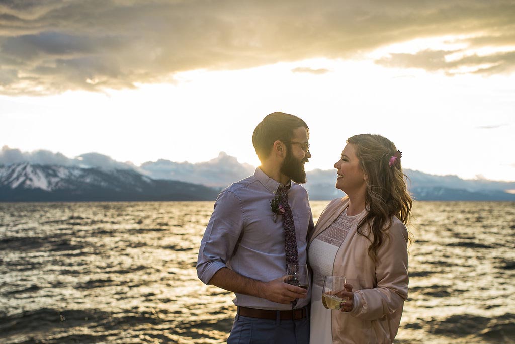Sunset scene with the married couple on the edge of Lake Tahoe