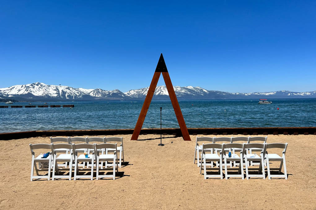 Chair and arch ceremony area on the shoreline of Lake Tahoe