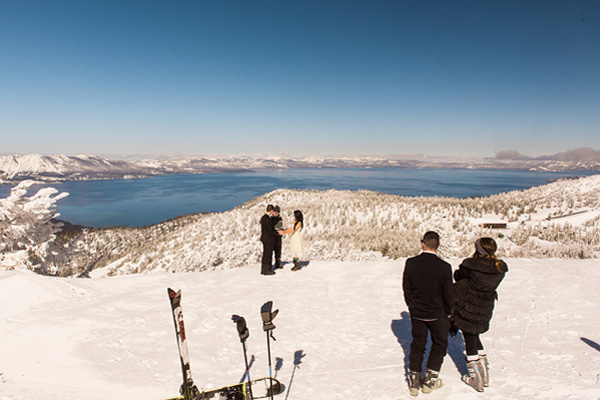 Guests watch as the minister conducts a wedding ceremony on the mountaintop at Heavenly resort