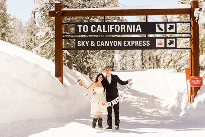 The newlyweds display their "Just Married" sign.