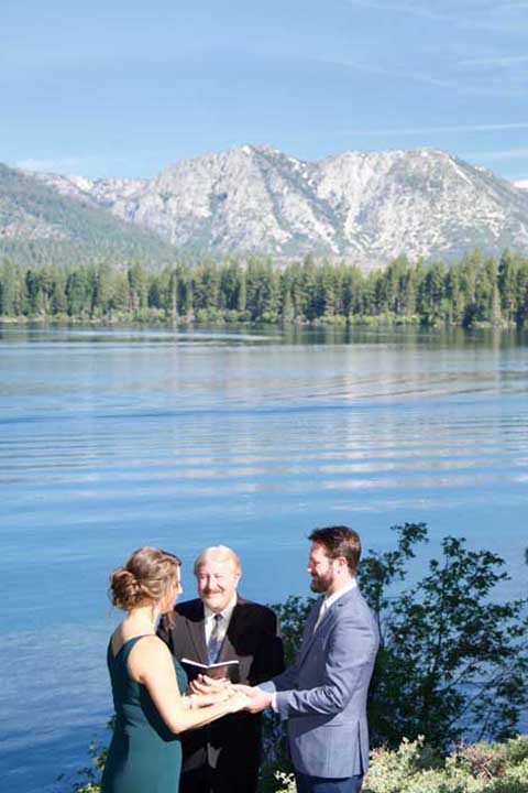 Wedding service being conducted by the waterside