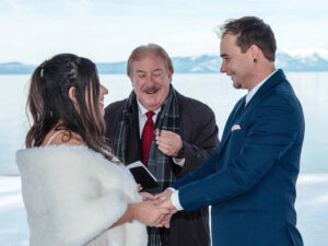 Minister is presenting the wedding rings to the marriage participants