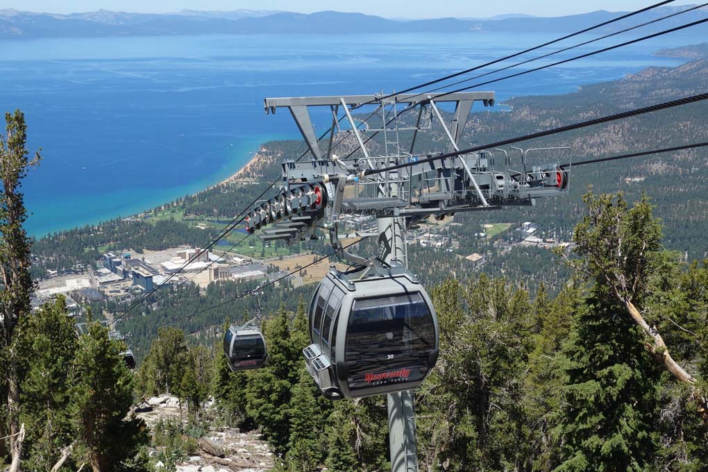 Ascending gondola cars and an amazing aerial view of Lake Tahoe.